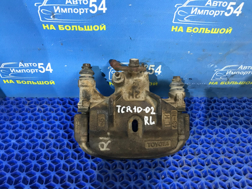 Суппорт тормозной задний левый TOYOTA ESTIMA 1999