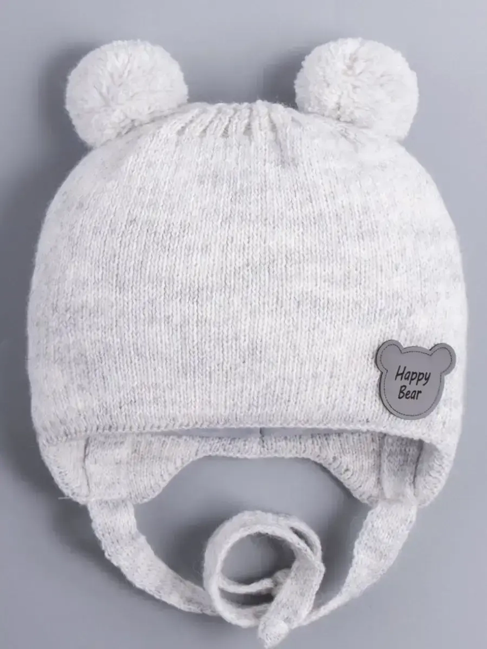 Шапка детская осенняя с завязками и помпонами