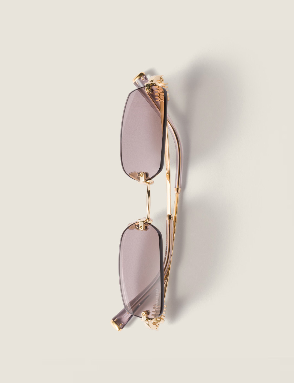 Солнцезащитные очки Miu Miu Eyewear Mauve Lenses Gold