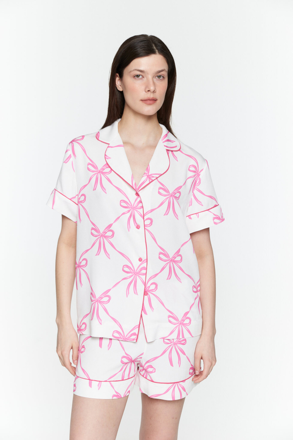 Блуза из вискозы с кантом и бантами