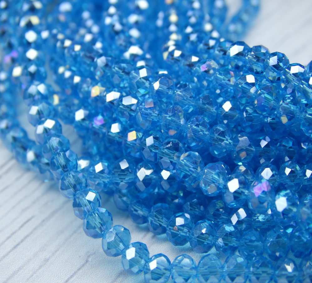 Хрустальные бусины "рондель", комплект из трех цветов: ярко-голубой с AB покрытием, светло-голубой с AB покрытием, светло-синий с AB покрытием, размер: 2х3 мм, общее количество: 290-300 бусин.