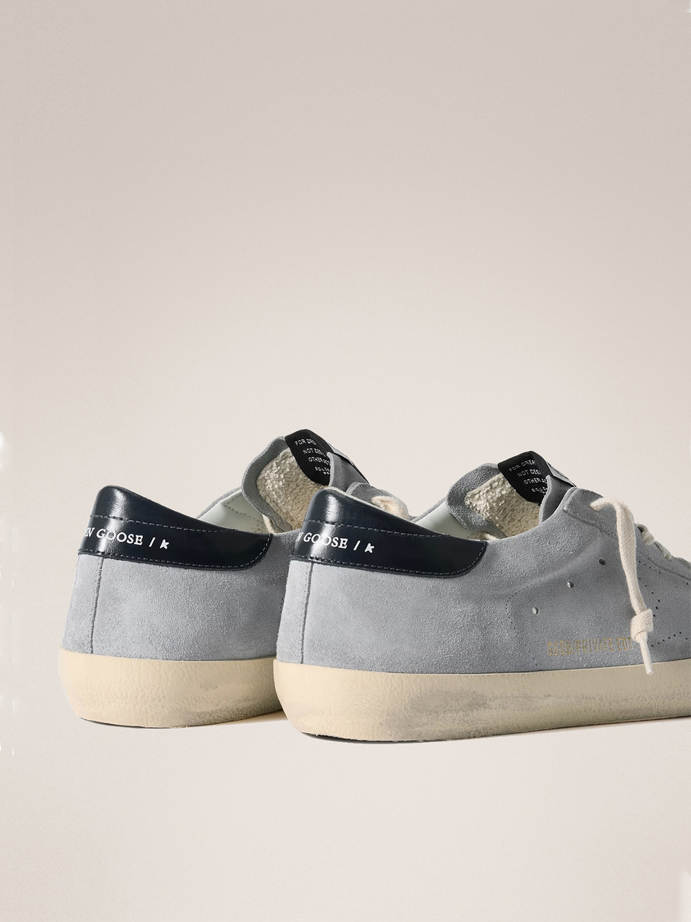 Men's Super Strar in light blue suede with a blue insert on the heel and a perforated star