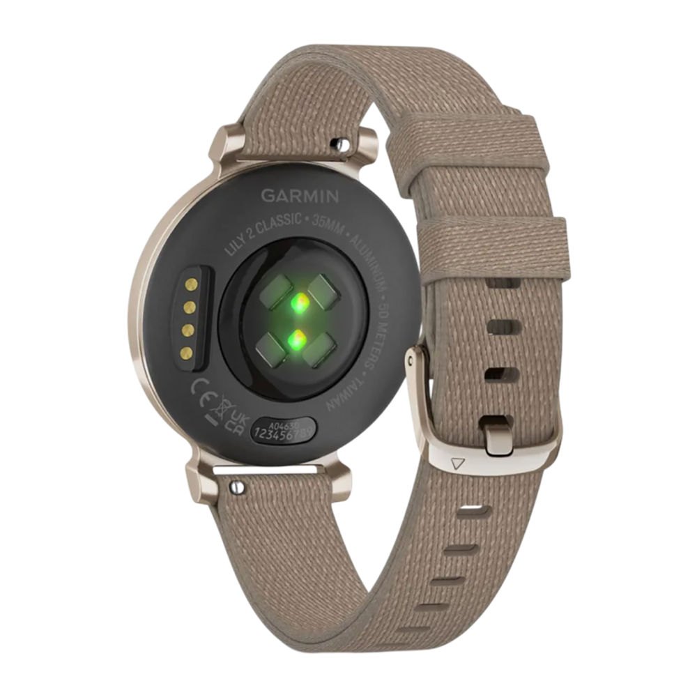 Спортивные часы Garmin Lily 2 Classic, нейлоновый ремешок кофейного цвета Кремово-золотистый безель из алюминия, стекло Gorilla Glass. Ремешок с классической застёжкой — на запястье обхватом 110–175 мм