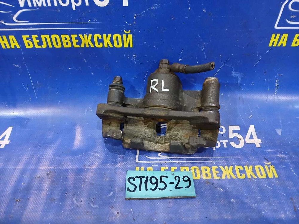 Суппорт тормозной задний левый TOYOTA CALDINA 1994