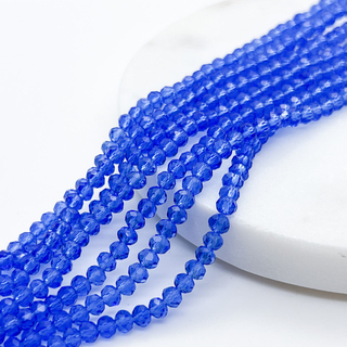 Бусины стекло, цвет синий, размер около 3*4 мм, цена за нить 38 см