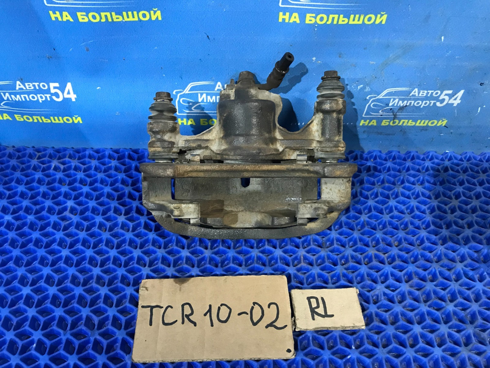 Суппорт тормозной задний левый TOYOTA ESTIMA 1999