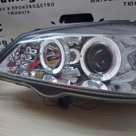 Передние фары Opel Astra G angel eyes chrome