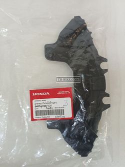 64504-K35-V00. COVER, HEADLIGHT UNDER. HONDA