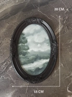 Картина в овальной рамке