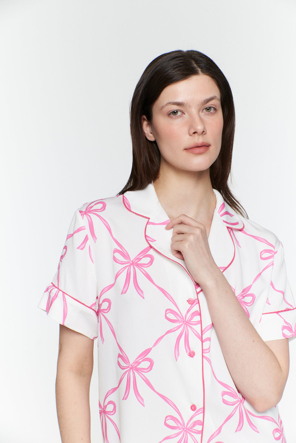 Блуза из вискозы с кантом и бантами