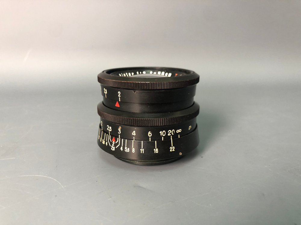 Praktica + Biometar 5,8cm 1:2, зеркало исцарапано, присутствуют пузырьки воздуха.