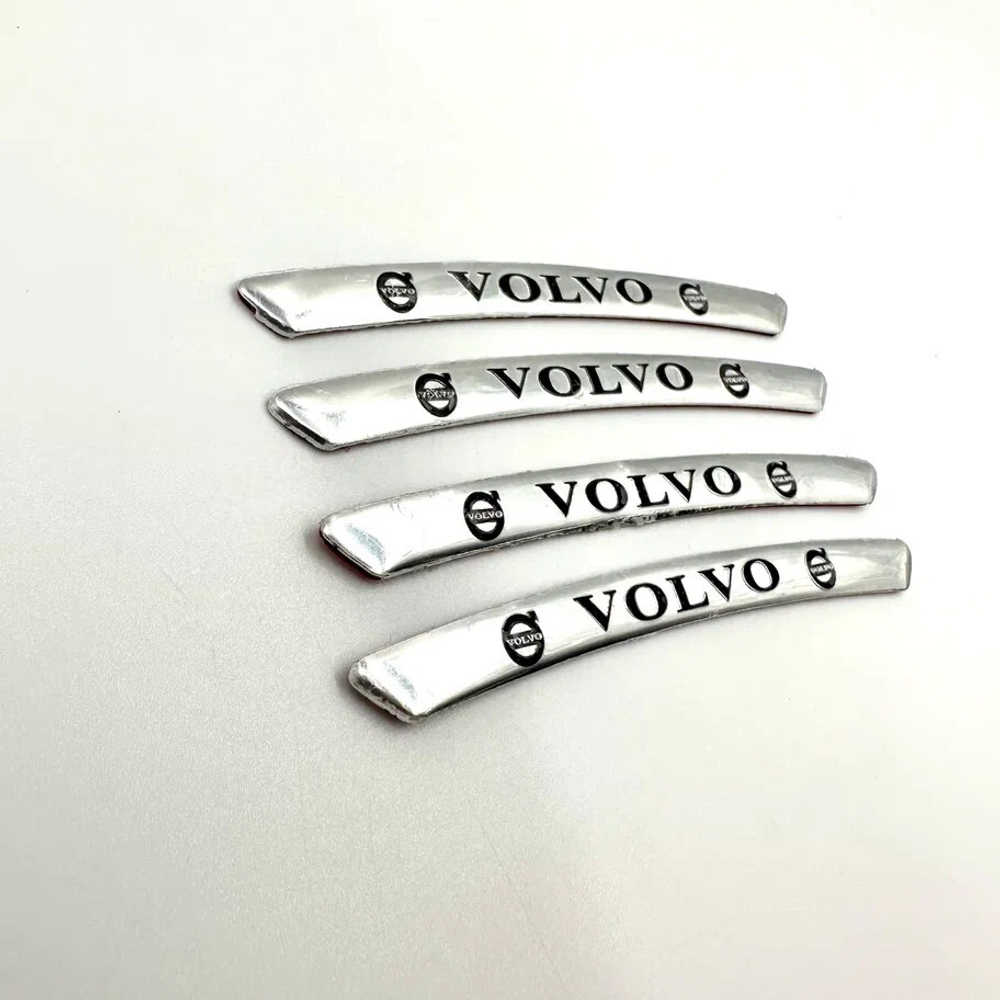 Наклейки Volvo черные объемные пластик (шильдик Вольво, 9х0,8см). Серебристые с черной надписью и лого Вольво - 4шт в комплекте