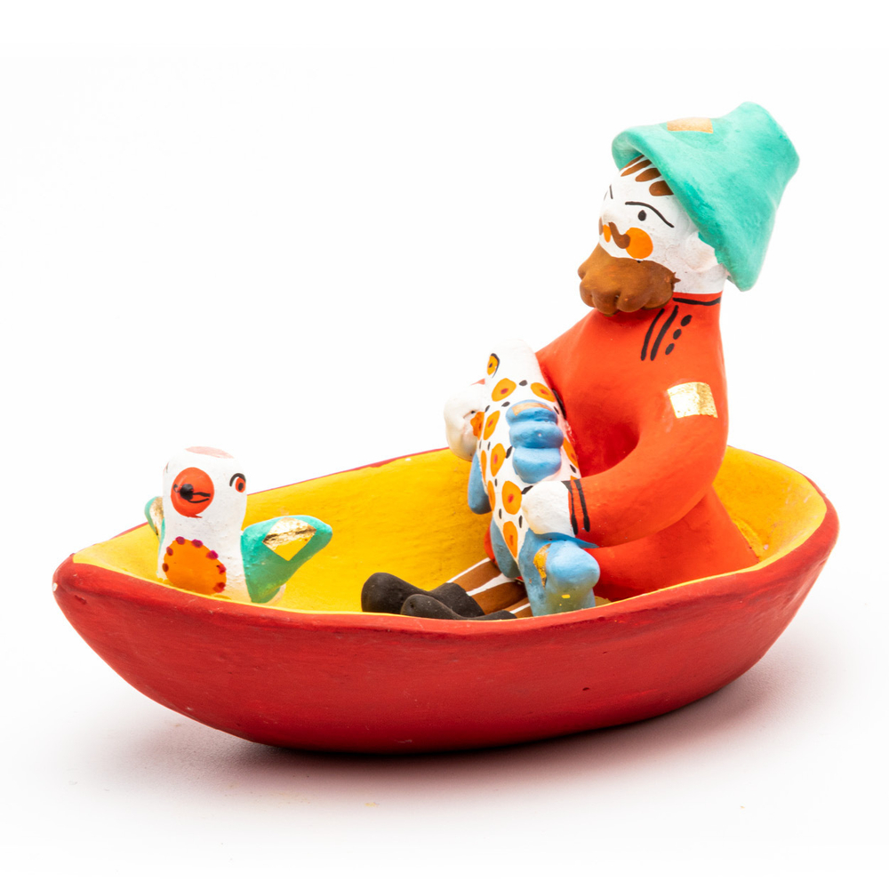 Фигурка "Мужик в лодке с рыбой и птичкой"