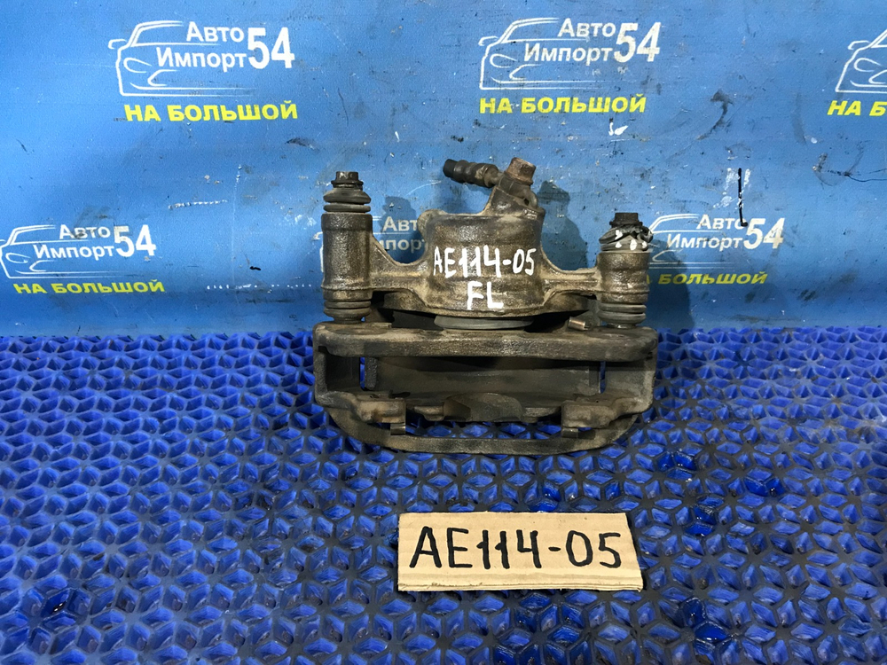 Суппорт тормозной передний левый TOYOTA SPRINTER 1999