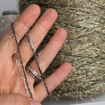 DECORATION - Millefili S.р.A.; 34% люрекс, 66% п/а; 380м/100гр; золотая травка на черном эластичном шнурке.