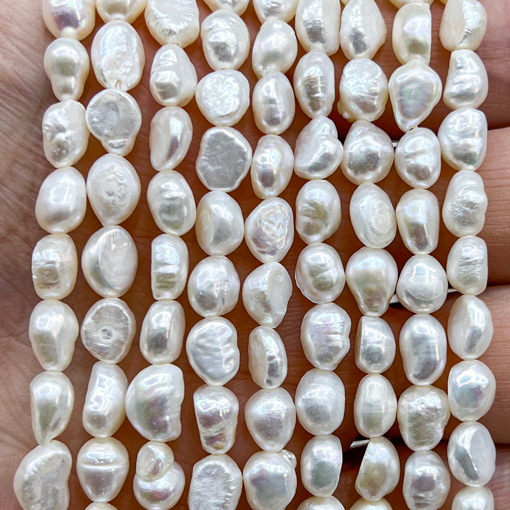 Жемчуг 2А речной бусины 5-6 мм, на нитке 38 см