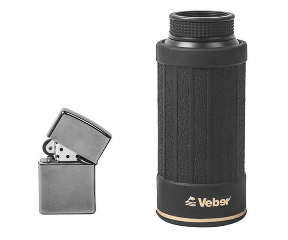 Сложенный монокуляр Monty 10x50 BR рядом с зажигалкой