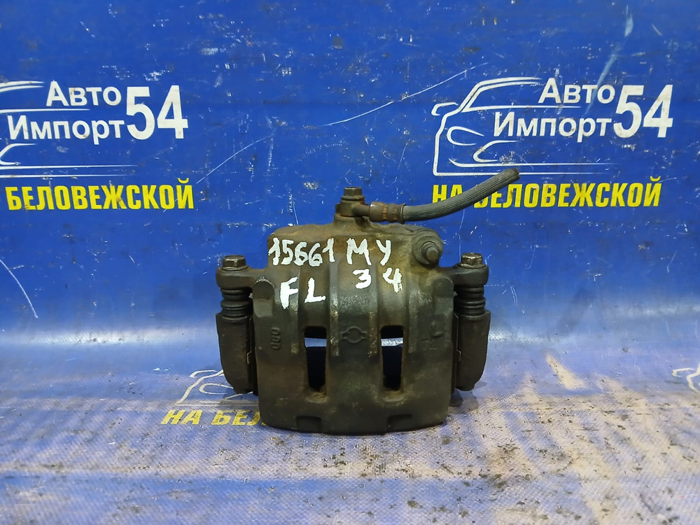 Суппорт тормозной передний левый NISSAN CEDRIC 1999-2004