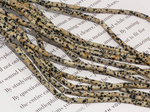 Нить бусин из далматиновой яшмы, трубочки 4х13мм