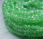 Хрустальные бусины "рондель", комплект из трех цветов: светло-зеленый с AB покрытием, зеленый с AB покрытием, темно-зеленый с AB покрытием, размер: 3х4 мм, общее количество: 290-300 бусин.