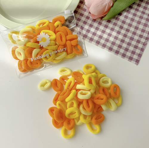 Набор резинок для волос в косметичке 50 шт. Цвет Микс оранжевый.