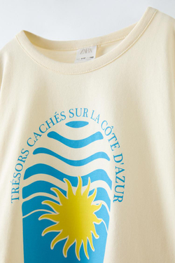 ZARA ФУТБОЛКА С ДЕКОРАТИВНЫМ ВЫРЕЗОМ И ПРИНТОМ «СОЛНЦЕ», ЭКРЮ