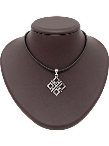 Фото Макошь оберег подвеска из серебра, вид на постаменте.