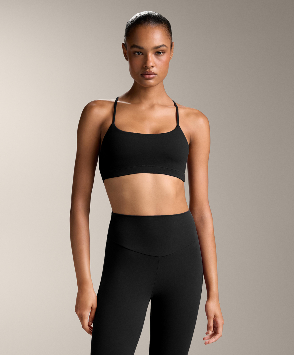 Oysho Спортивный бюстгальтер Comfortlux с перекрещивающимися бретелями и легкой поддержкой, черный