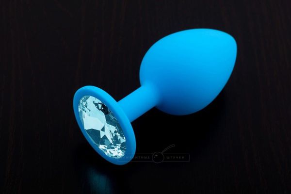 Большая голубая силиконовая пробка с голубым кристаллом - 9 см.