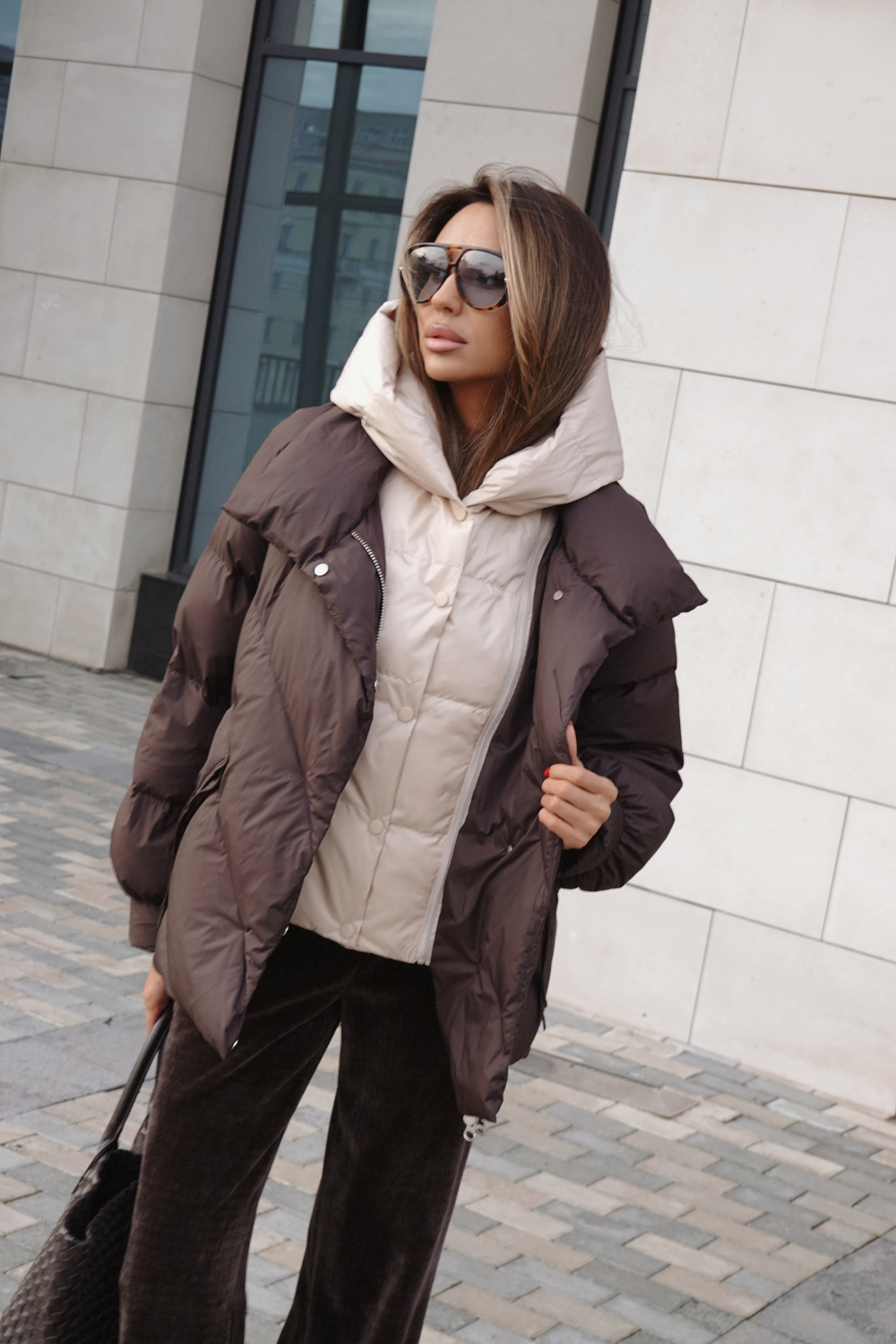 Пуховик средней длины с декором на карманах