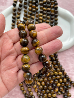 Нить бусин тигрового глаза 10,5мм