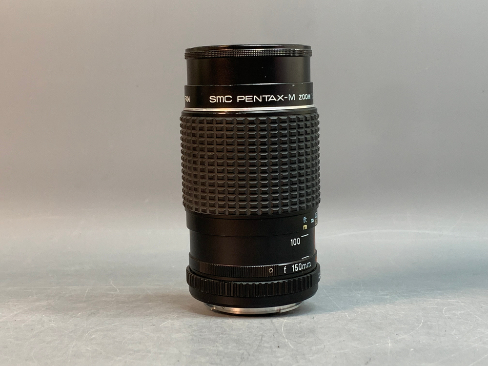 SMC Pentax-M 75–150 mm f/4 Небольшие точки внутри линзы