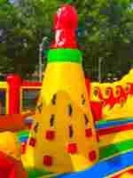 Коммерческий надувной батут «Драконы в тропиках» с механизированной головой, 14*7*7,3 м