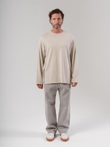 Бежевый лонгслив с необработанным краем