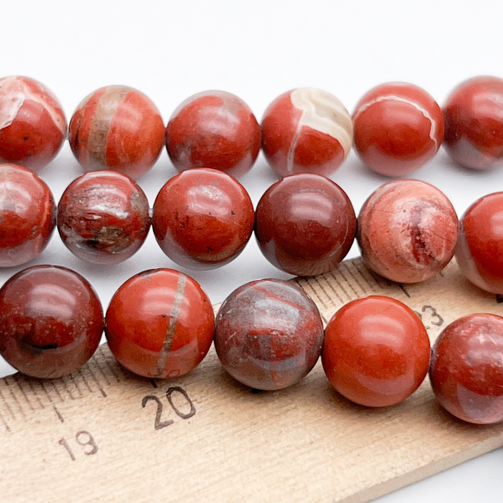 Яшма красная бусины, диаметр 10,6-10,8 мм, цена за 9 шт (1/4 нити)