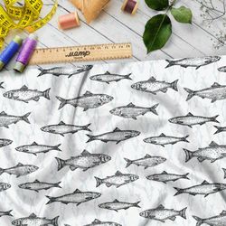 Ткань флис рыбы на бежевом фоне