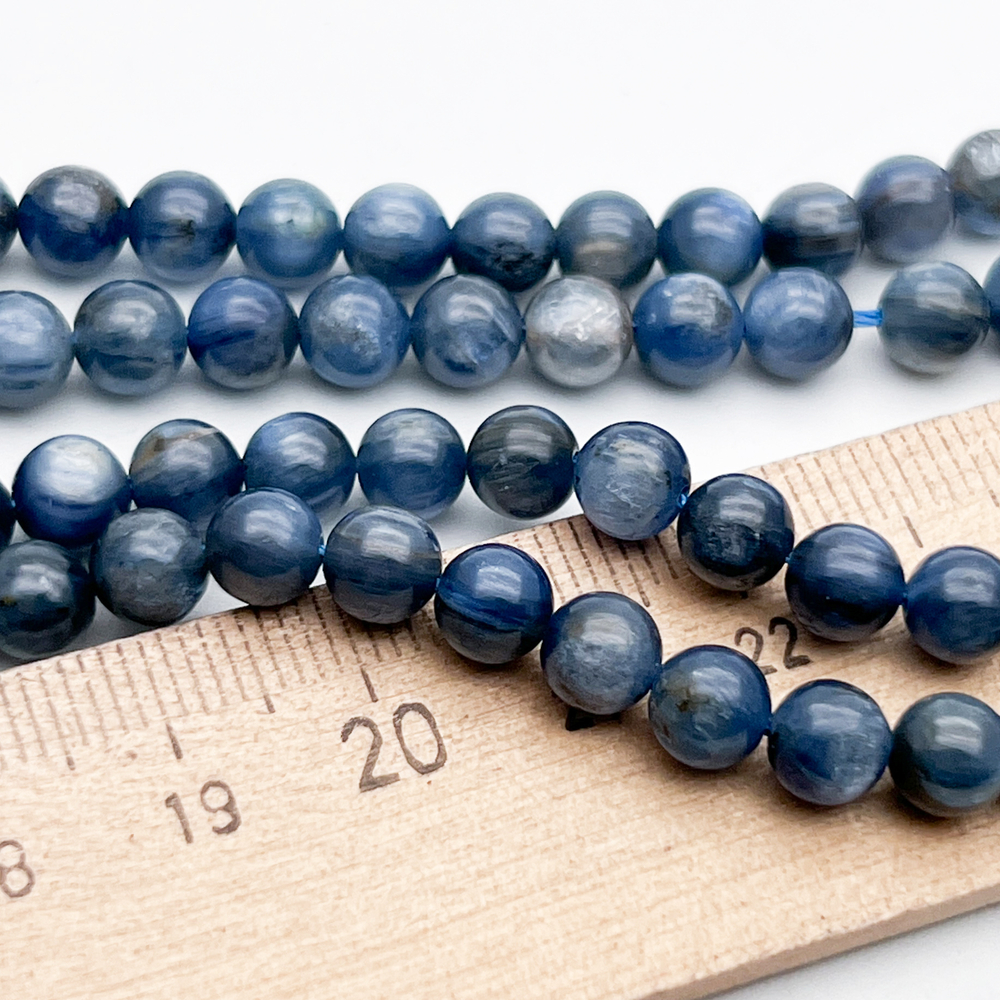 Кианит бусины (тонирован), диаметр 5,9-6,1 мм, цена за 16-17 шт (1/4 нити)