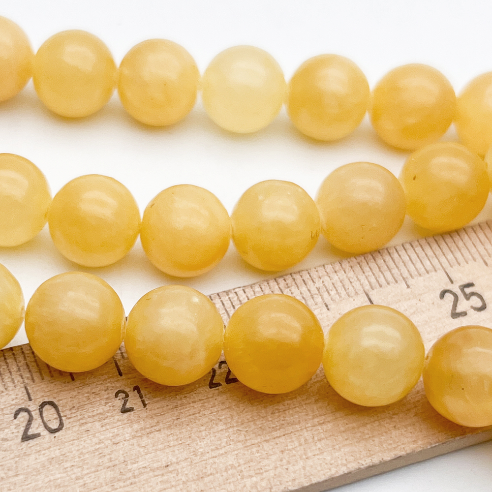 Кальцит желтый бусины, диаметр около 10,3-10,7 мм, цена за 18-19 шт (1/2 нити)