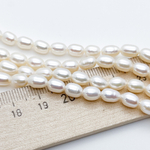 Жемчуг, размер около 4,5*7,5 мм, цена за 24-25 шт (1/2 нити)