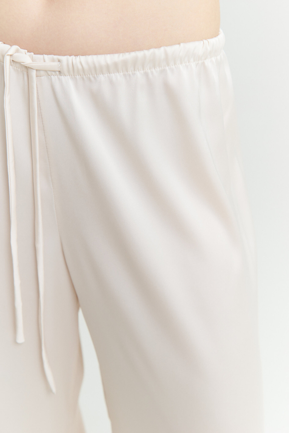 Шелковые брюки молочные