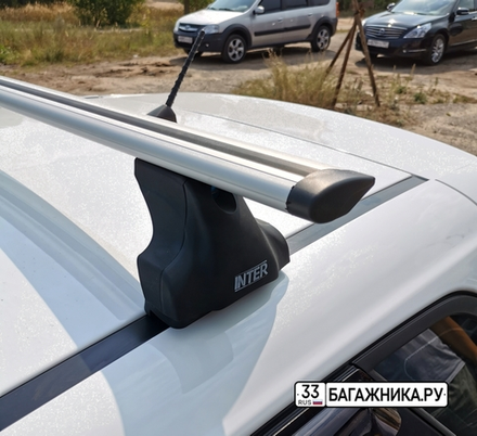 Багажник Интер Спектр на крышу Kia Ceed II хэтчбек 2007-...  в штатные места 8894 крыловидные дуги 120 см.