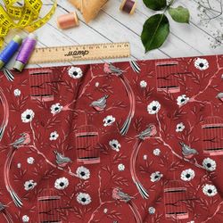Ткань флис мелкие снегири, цветы и птичьи клетки на бордовом фоне
