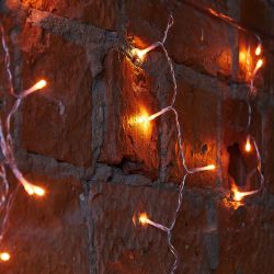 ULD-B12006-195-TTK AMBER IP44 Бахрома светодиодная с эффектом мерцания. 12м. Соединяемая. 195 светодиодов. Янтарный свет. Провод прозрачный. ТМ Uniel