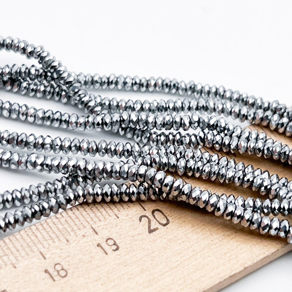 Гематит Рондель граненый бусины (имитация), цвет серебристый, размер около 1,5*2 мм, цена за отрезок 19 см (1/2 нити)