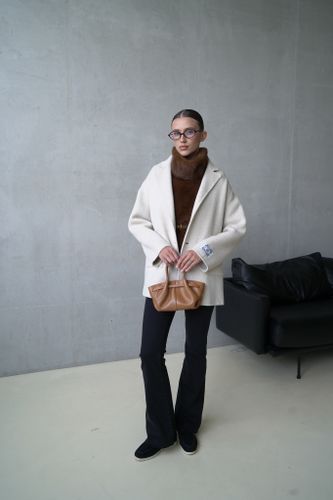 Двубортный пиджак из шерсти молочного цвета