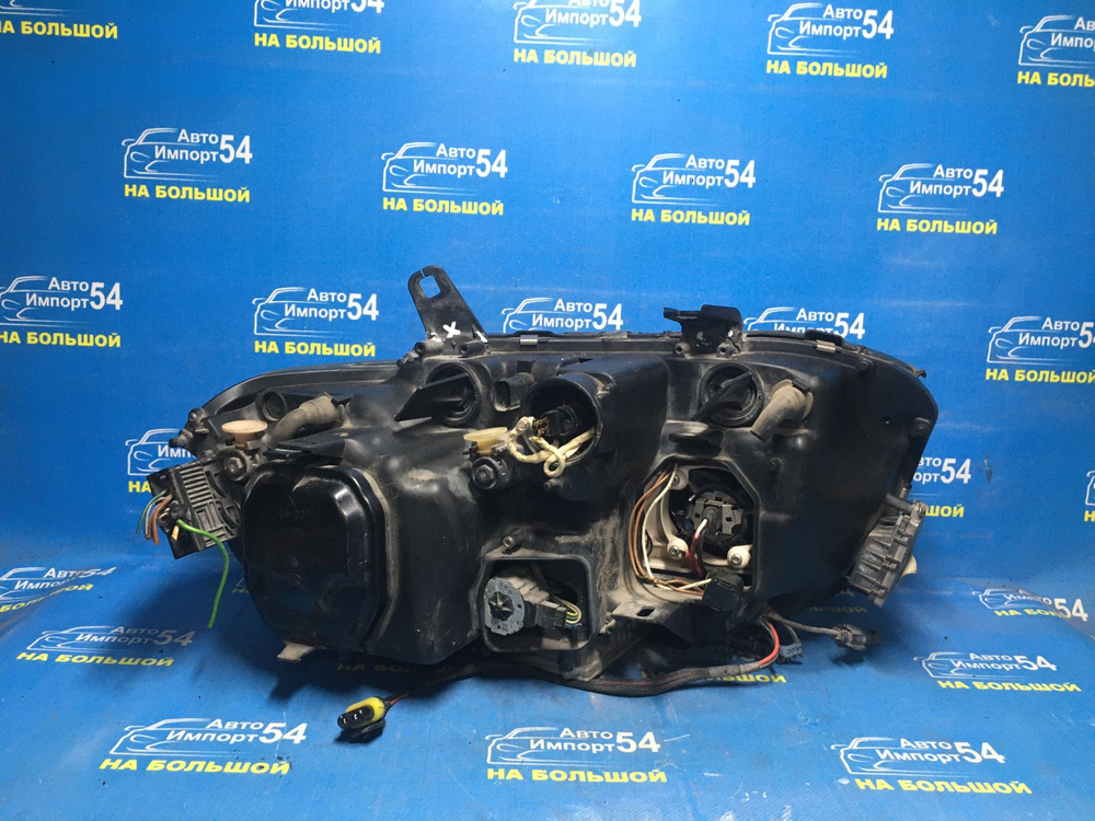 Фара передняя левая BMW 7-Series 2004