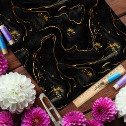 Ткань шелк Армани жидкое золото на чёрном фоне