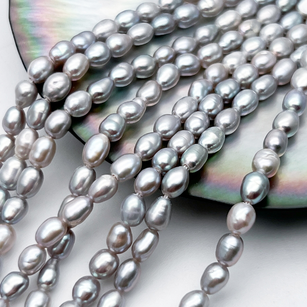 Жемчуг Рис бусины, цвет серый, размер около 4,5-5*3,5-4 мм, цена за отрезок 18 см (1/2 нити)