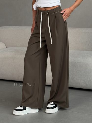 Коричневые женские брюки свободного кроя