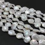 Жемчуг овальный плоский бусины 11мм